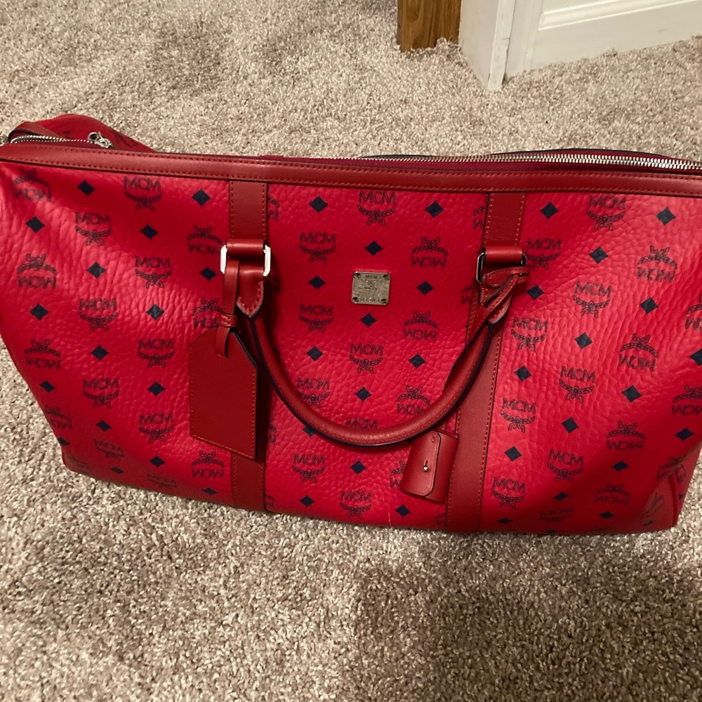 Used once brand new mcm travel bag for men and women